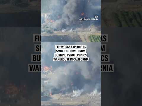 Fireworks explode as smoke billows from burning pyrotechnics warehouse in California