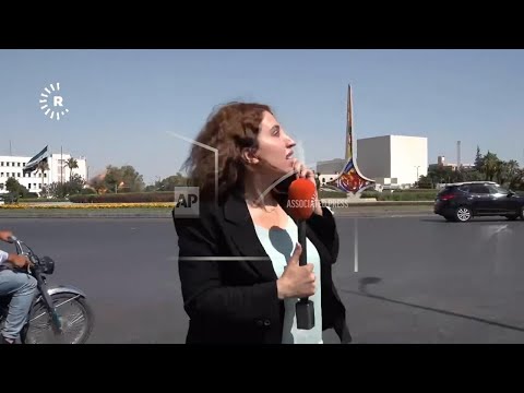 Reporter in Damascus reacts as Israeli strikes hit Syrian Defense Ministry behind her