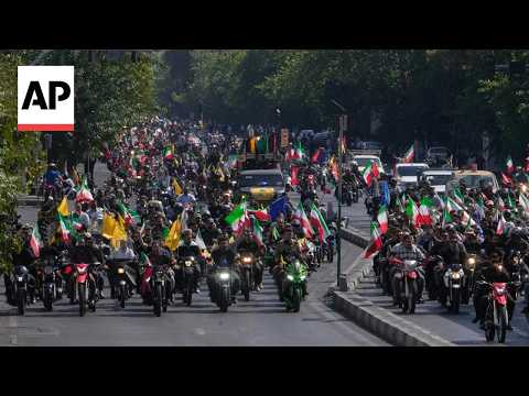 Thousands of government supporters stage a motorcycle rally in Iran